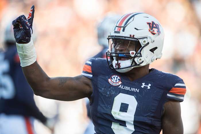 Auburn Tigers linebacker Zakoby McClain (9) celebrates after deflecting a pass as Auburn Tigers take on Mississippi State Bulldogs at Jordan-Hare Stadium in Auburn, Ala., on Saturday, Nov. 13, 2021. Mississippi State Bulldogs defeated Auburn Tigers 43-34.